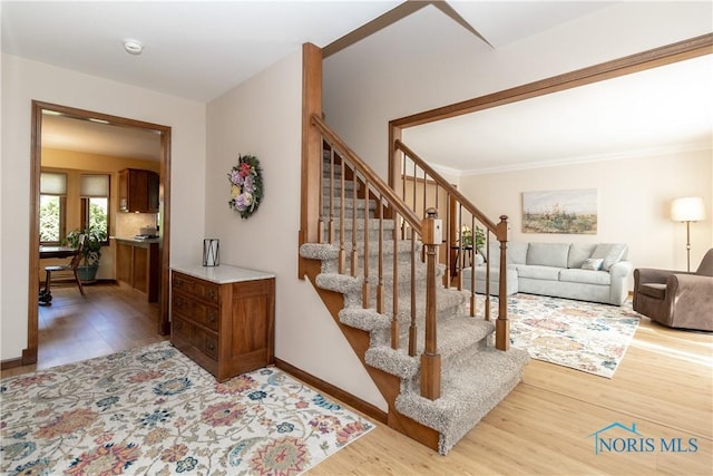 2439 Notting Hill Rd, Toledo, OH 43617 - stairs featuring wood finished floors and baseboards