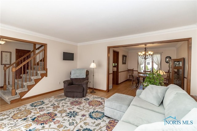 2439 Notting Hill Rd, Toledo, OH 43617 - living area with a chandelier, wood finished floors, ornamental molding, stairs, and baseboards