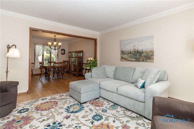 2439 Notting Hill Rd, Toledo, OH 43617 - living room with ornamental molding, a chandelier, and wood finished floors