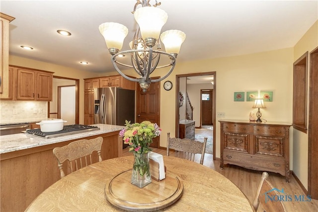 2439 Notting Hill Rd, Toledo, OH 43617 - dining space featuring a chandelier, light wood-style flooring, and recessed lighting