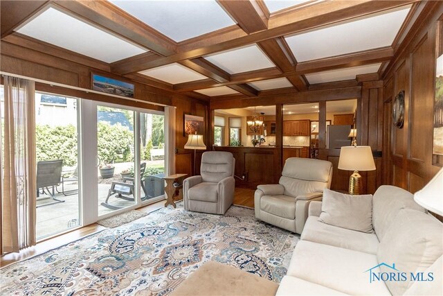 2439 Notting Hill Rd, Toledo, OH 43617 - living area with wooden walls, beamed ceiling, coffered ceiling, wood finished floors, and a chandelier