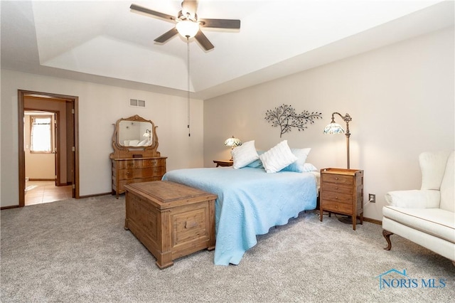 2439 Notting Hill Rd, Toledo, OH 43617 - bedroom with light colored carpet, a raised ceiling, baseboards, and a ceiling fan