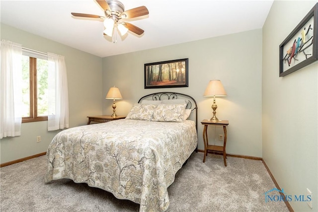 2439 Notting Hill Rd, Toledo, OH 43617 - bedroom with carpet, baseboards, and a ceiling fan