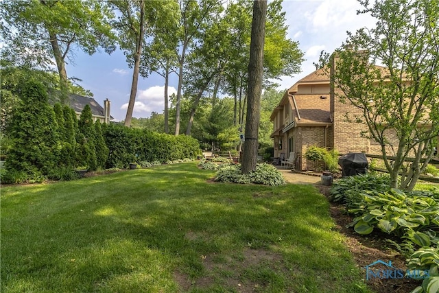 2439 Notting Hill Rd, Toledo, OH 43617 - view of grassy yard with a patio