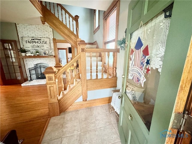 1520 S Clinton St, Defiance, OH 43512 - staircase with a fireplace and tile patterned flooring