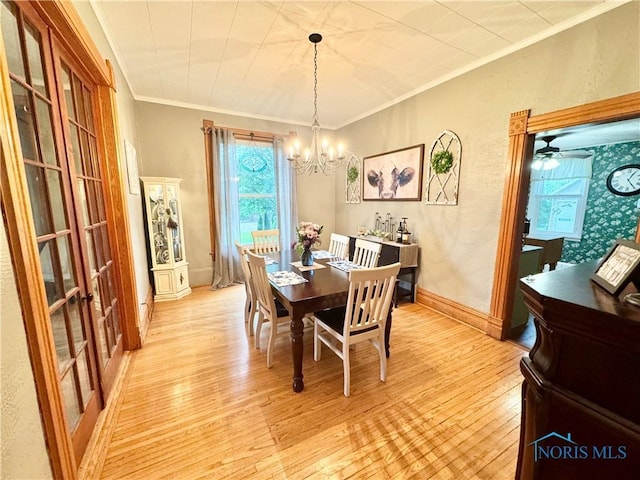 1520 S Clinton St, Defiance, OH 43512 - dining room featuring light wood-style floors, a chandelier, crown molding, plenty of natural light, and baseboards