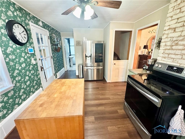 1520 S Clinton St, Defiance, OH 43512 - kitchen with appliances with stainless steel finishes, wallpapered walls, ornamental molding, dark wood-style flooring, and ceiling fan