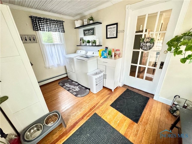 1520 S Clinton St, Defiance, OH 43512 - laundry area featuring a baseboard heating unit, washer and dryer, ornamental molding, and wood-type flooring