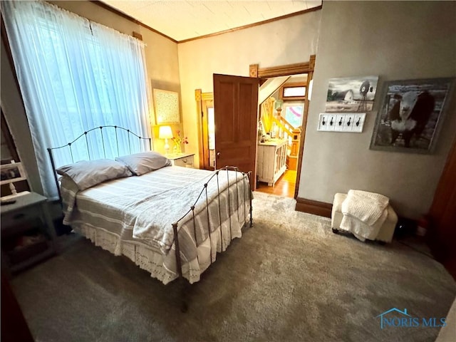 1520 S Clinton St, Defiance, OH 43512 - bedroom with carpet floors, vaulted ceiling, and ornamental molding