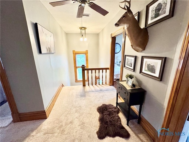 1520 S Clinton St, Defiance, OH 43512 - hall featuring carpet, baseboards, and an upstairs landing