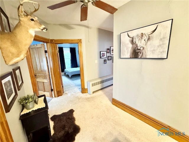 1520 S Clinton St, Defiance, OH 43512 - corridor featuring radiator, light colored carpet, baseboards, and lofted ceiling