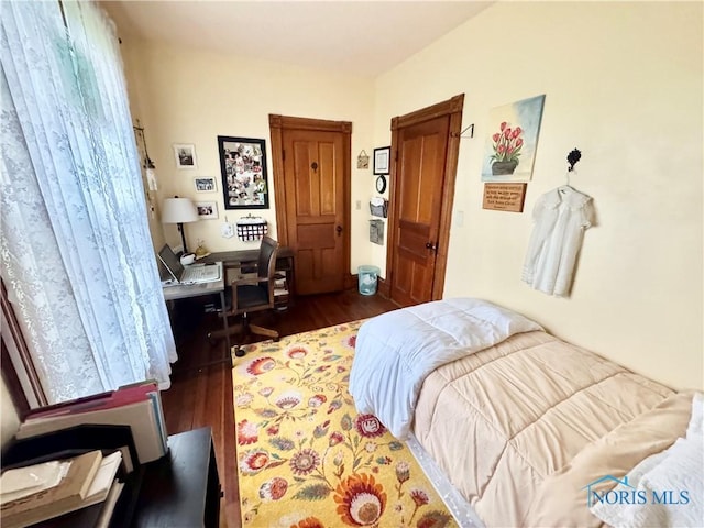 1520 S Clinton St, Defiance, OH 43512 - bedroom with dark wood finished floors and a desk