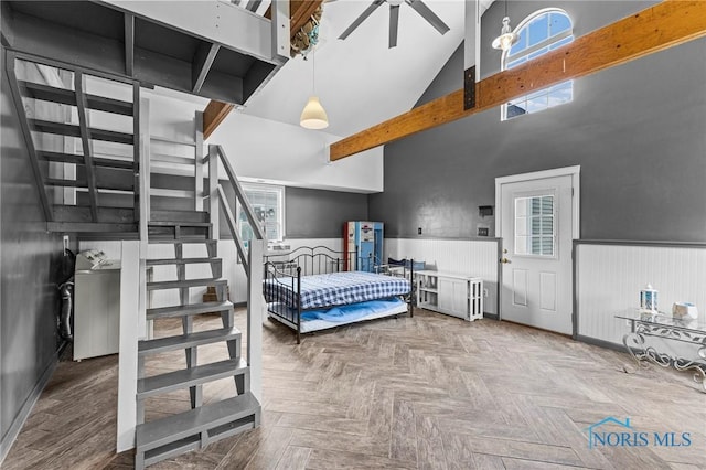 254 N Worthy St, Marblehead, OH 43440 - bedroom featuring a wainscoted wall, high vaulted ceiling, and multiple windows