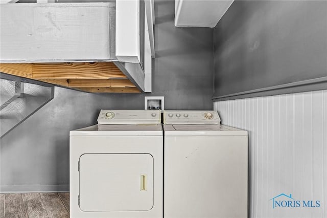254 N Worthy St, Marblehead, OH 43440 - laundry area featuring washer and clothes dryer and wood finished floors