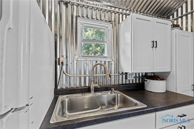 254 N Worthy St, Marblehead, OH 43440 - kitchen featuring dark countertops and white cabinets