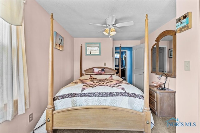 254 N Worthy St, Marblehead, OH 43440 - carpeted bedroom with arched walkways, ceiling fan, and a textured ceiling