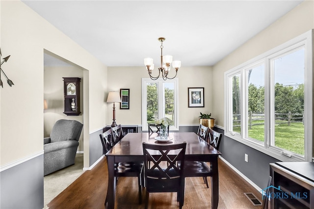 826 Touraine Ave, Bowling Green, OH 43402 - dining space with wood finished floors, a chandelier, and baseboards