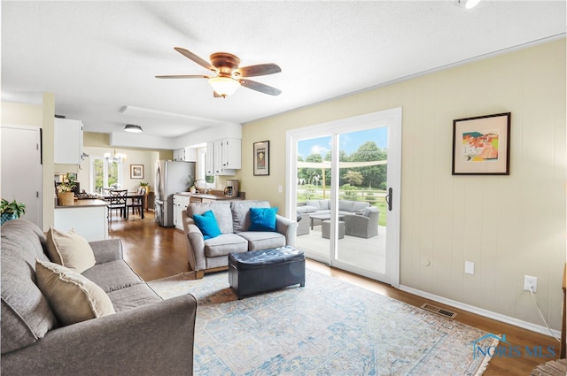826 Touraine Ave, Bowling Green, OH 43402 - living area featuring a ceiling fan, wood finished floors, and baseboards