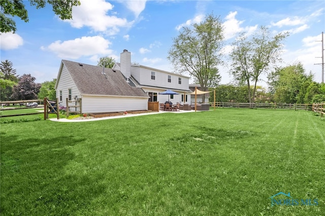 826 Touraine Ave, Bowling Green, OH 43402 - back of house with a patio area and a chimney