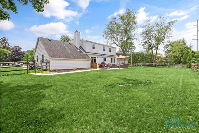 826 Touraine Ave, Bowling Green, OH 43402 - back of house with a patio area and a chimney