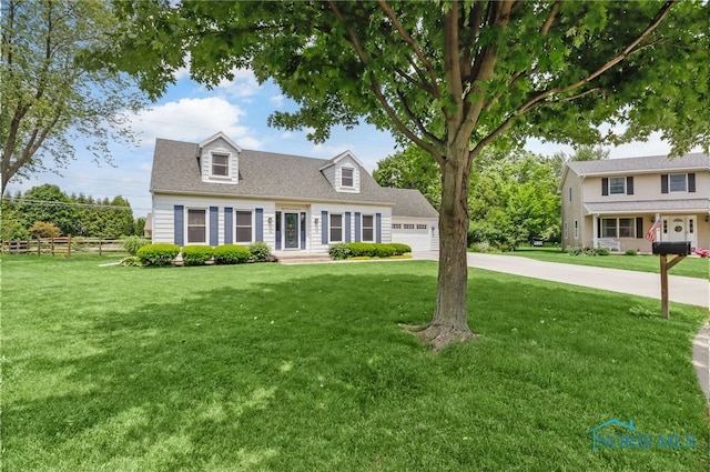 826 Touraine Ave, Bowling Green, OH 43402 - cape cod home featuring a garage, driveway, and a shingled roof