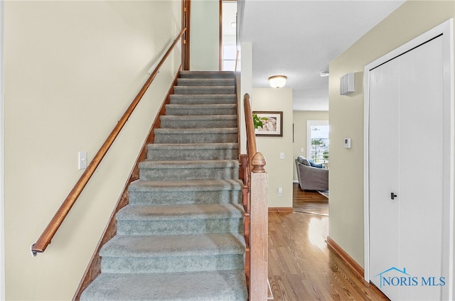 826 Touraine Ave, Bowling Green, OH 43402 - stairs with wood finished floors and baseboards