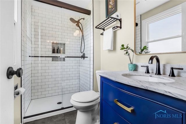 826 Touraine Ave, Bowling Green, OH 43402 - bathroom featuring vanity, a shower stall, toilet, and tile patterned flooring