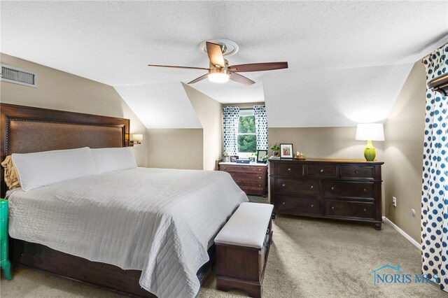 826 Touraine Ave, Bowling Green, OH 43402 - bedroom featuring light carpet, vaulted ceiling, ceiling fan, baseboards, and a textured ceiling