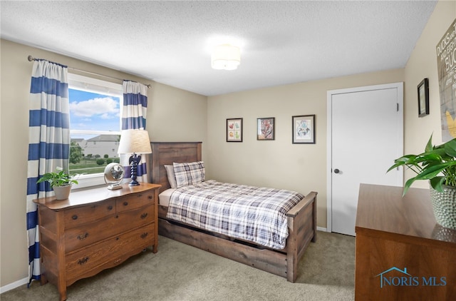 826 Touraine Ave, Bowling Green, OH 43402 - carpeted bedroom with a textured ceiling