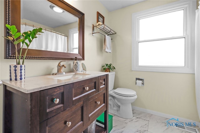 826 Touraine Ave, Bowling Green, OH 43402 - bathroom with toilet, marble finish flooring, vanity, and baseboards