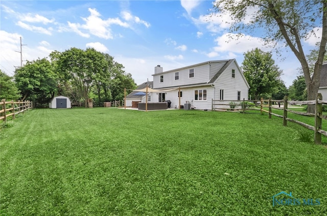 826 Touraine Ave, Bowling Green, OH 43402 - back of property with a chimney and cooling unit