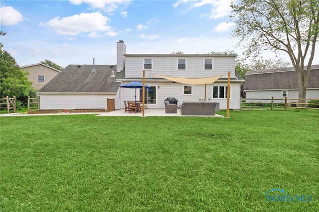 826 Touraine Ave, Bowling Green, OH 43402 - rear view of house featuring a patio and a chimney
