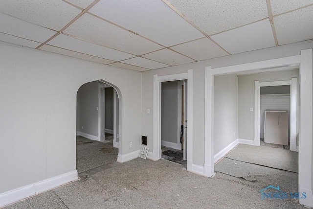 426 Arden Pl, Toledo, OH 43605 - spare room featuring a paneled ceiling, arched walkways, and baseboards