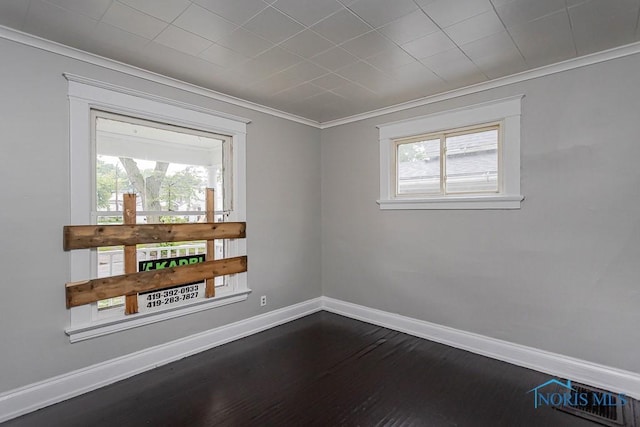 426 Arden Pl, Toledo, OH 43605 - unfurnished room with baseboards, crown molding, and dark wood finished floors