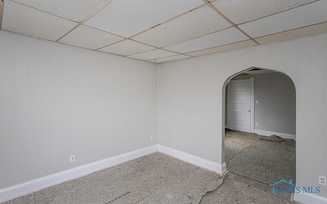 426 Arden Pl, Toledo, OH 43605 - spare room with arched walkways, a drop ceiling, and baseboards