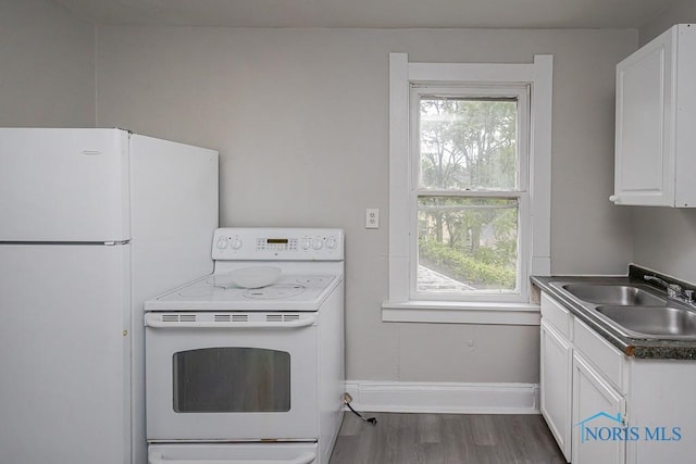 426 Arden Pl, Toledo, OH 43605 - kitchen featuring white appliances, a sink, white cabinetry, wood finished floors, and baseboards