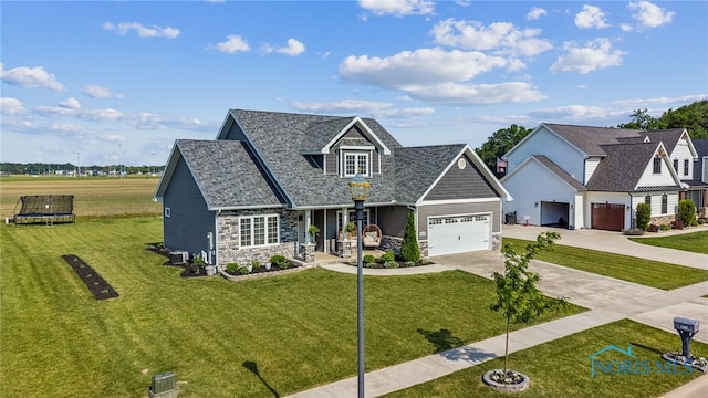 1209 Apache Dr, Wauseon, OH 43567 - view of front of property with stone siding, a front lawn, driveway, and a garage
