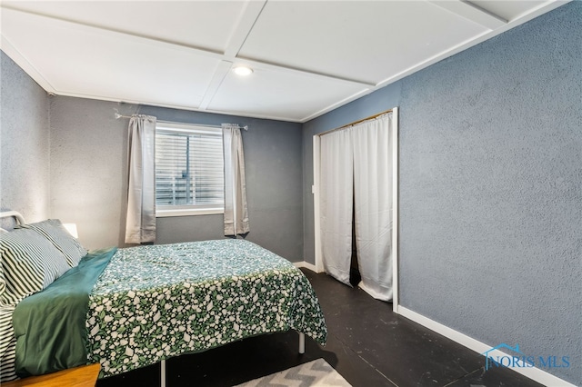 1209 Apache Dr, Wauseon, OH 43567 - bedroom featuring coffered ceiling, finished concrete flooring, and a textured wall