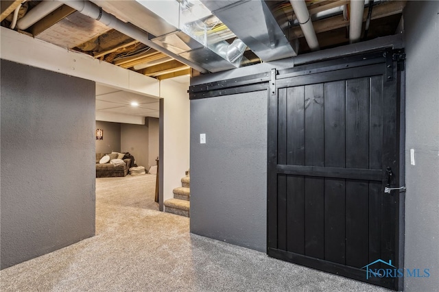 1209 Apache Dr, Wauseon, OH 43567 - basement featuring carpet flooring, a textured wall, and stairs