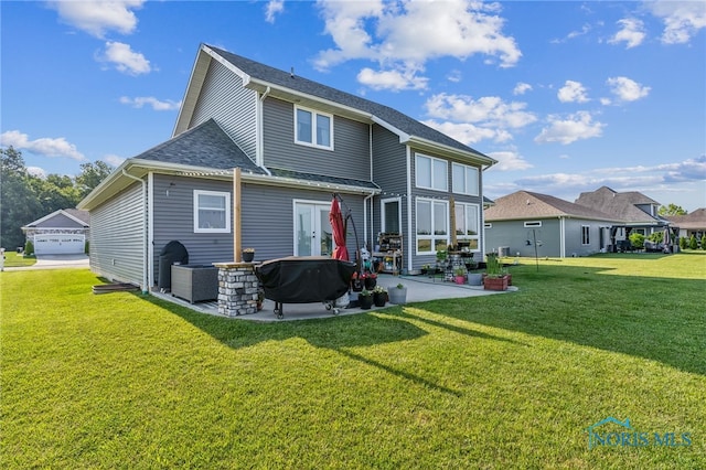 1209 Apache Dr, Wauseon, OH 43567 - rear view of property with a patio, a yard, and a shingled roof