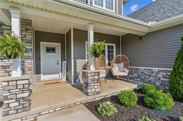 1209 Apache Dr, Wauseon, OH 43567 - entrance to property featuring a porch, stone siding, and roof with shingles
