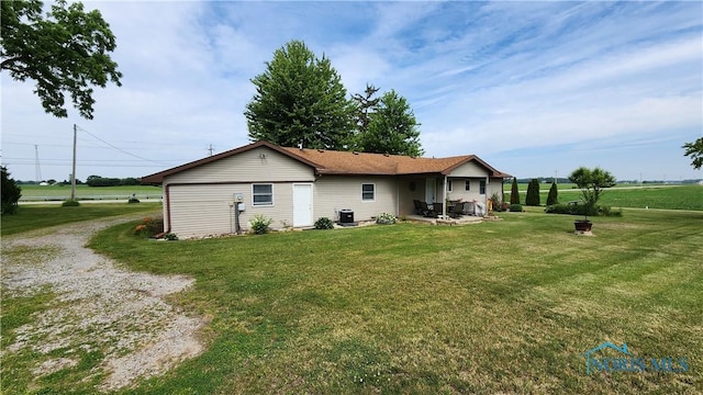 2384 State Route 109, Delta, OH 43515 - back of house with a lawn and a patio area
