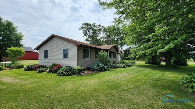 2384 State Route 109, Delta, OH 43515 - view of property exterior featuring a lawn