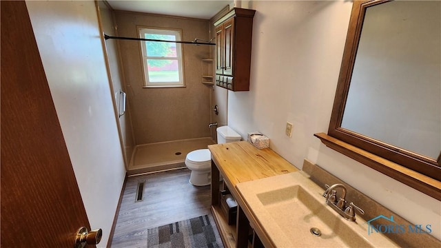 2384 State Route 109, Delta, OH 43515 - full bathroom featuring a shower stall, wood finished floors, and vanity