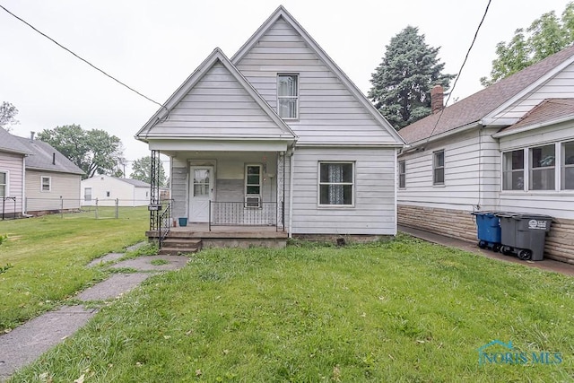 2721 Fremont St, Toledo, OH 43605 - rear view of house featuring a porch