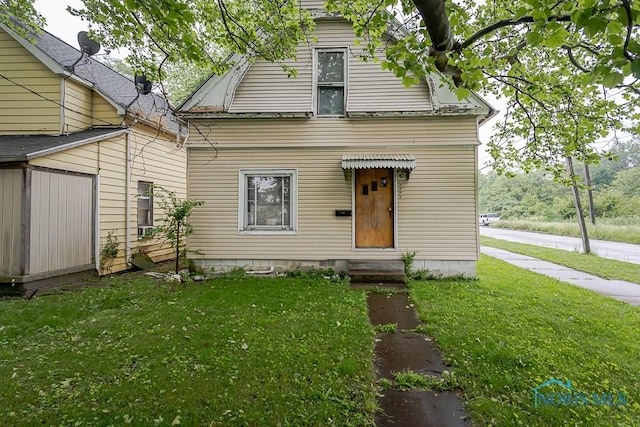 2602 Fremont St, Toledo, OH 43605 - view of front of house featuring a front lawn and entry steps