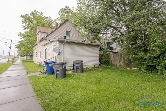 2602 Fremont St, Toledo, OH 43605 - view of side of home featuring a chimney