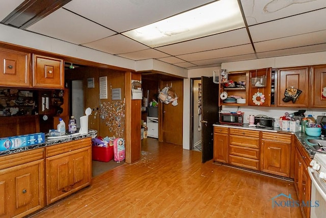 2602 Fremont St, Toledo, OH 43605 - bar area with a paneled ceiling, light wood finished floors, and stainless steel gas range