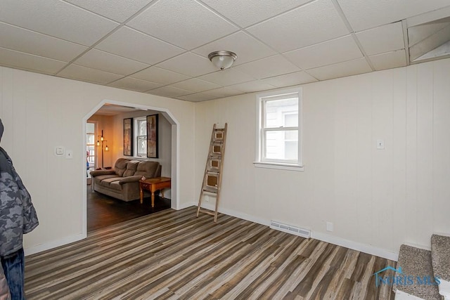 635 Plymouth St, Toledo, OH 43605 - sitting room featuring arched walkways, wood finished floors, a paneled ceiling, and baseboards
