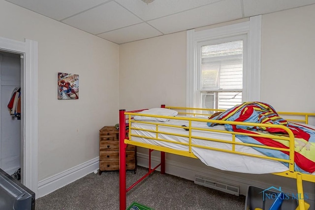 635 Plymouth St, Toledo, OH 43605 - bedroom with carpet flooring, a drop ceiling, and baseboards